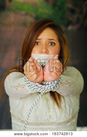 CLose up portrait of terrified young girl kidnapped and bonded
