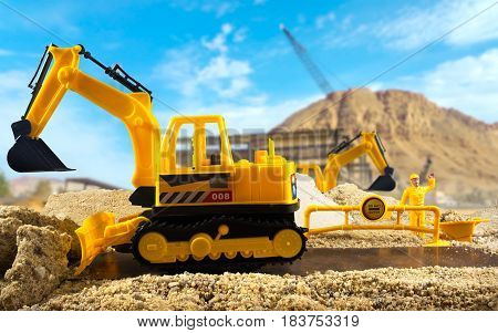 Excavator & worker toys standing on a construction ground on a sunny day. Background used from Pixabay under cc0 license.