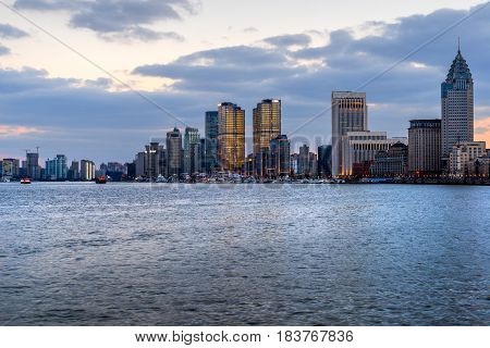 River And Modern Buildings Against Skyreflection of cityscape in rivershot in ShanghaiChina.