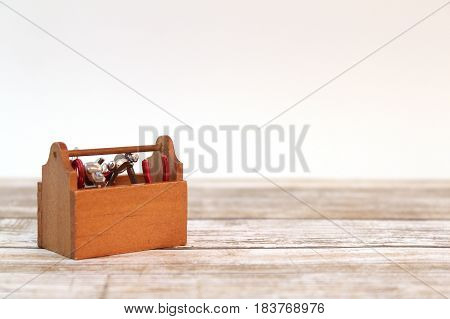 Miniature tool box isolated on white background.