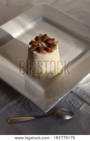 Paskha is a festive dish made in Eastern Orthodox countries. Curd Easter and bunch of flower in close up on the dark background