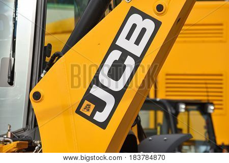 VILNIUS LITHUANIA - APRIL 27: JCB heavy duty equipment vehicle and logo on April 27 2017 in Vilnius Lithuania. JCB corporation is manufacturing equipment for construction and agriculture.