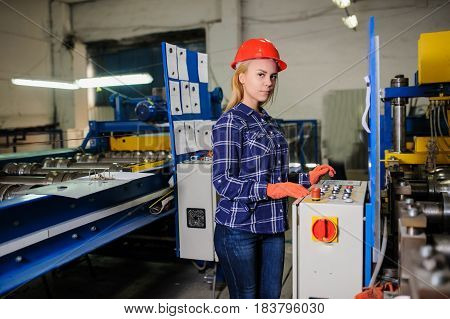 Woman In Red Safety Helmet Work As Industrial Worker