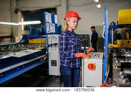 Woman In Red Safety Helmet Work As Industrial Worker