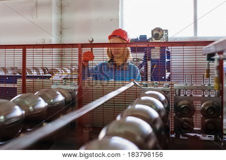 Woman In Red Safety Helmet Work As Industrial Worker