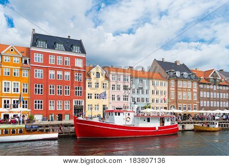 COPENHAGEN DENMARK - JULY 31 2016: Summer view of the famous Nyhavn with its colorful buildings