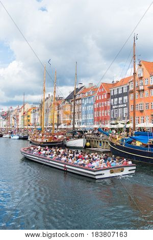 COPENHAGEN DENMARK - JULY 31 2016: Summer view of the famous Nyhavn with its colorful buildings
