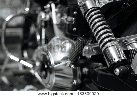 Power in every detail. Nice cool old motorcycle being repaired and maintained in lovely vintage garage