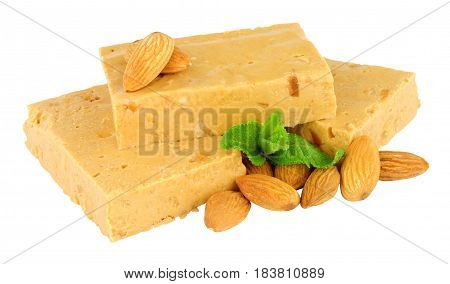Soft nougat candy portions with almonds isolated on a white background