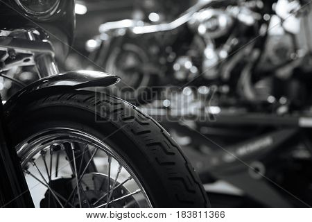 Ideal texture. New cool patterned rubber being installed on powerful heavy motorbike for going on new trips