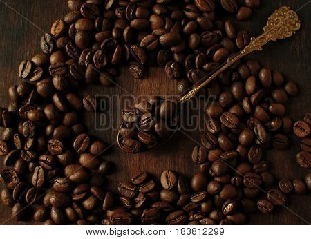 Still life with coffee beans. A bitterly drink from freshly ground coffee is the best drink.