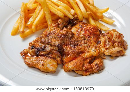 Fried Chicken With Fries On White Plate