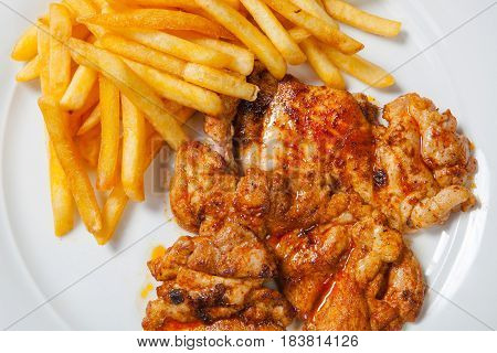 Fried Chicken With Fries On White Plate