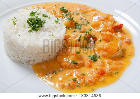 Souse Shrimp With Greens And Rice On A White Background