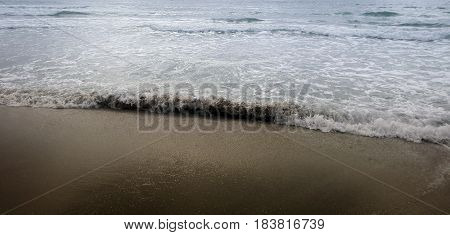A picture of the beach at sunrise.