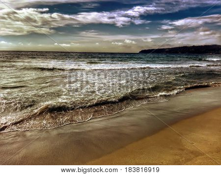 A picture of the beach at sunrise.