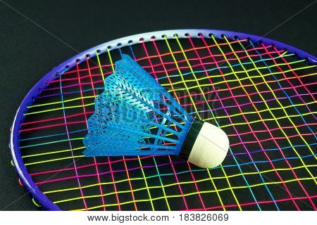 Color badminton equipment with black background, detail
