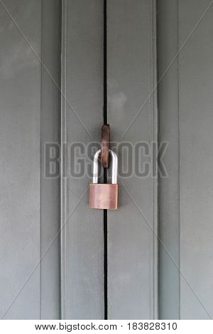 Wooden door lock by Steel padlock for Safety concept.
