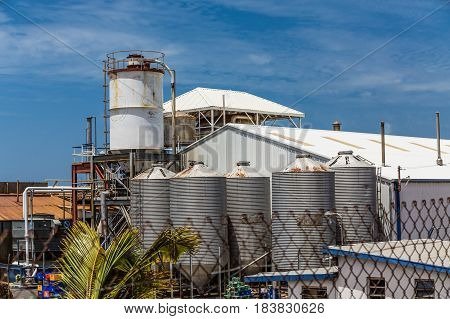 Beer Factory Beyond Chain Link Fence