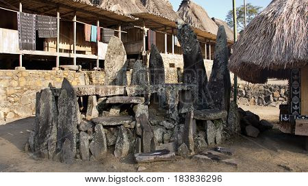 Stone tablets in Bena a traditional village with grass huts of the Ngada people in Flores near Bajawa Indonesia.