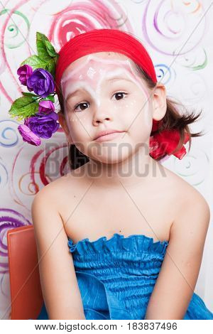 Portrait Of The Child With Flowers On Her Head