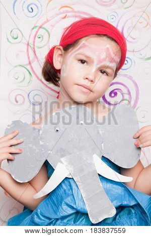 Portrait Of A Cute Child With  Elephant
