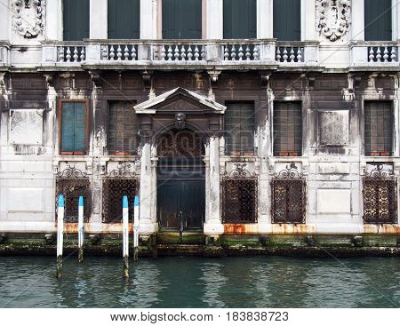 large ornate old building alongside a canal in venice