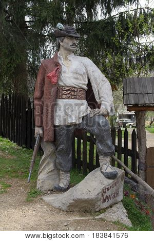 Kolochava Ukraine - April 18 2016: Monument to the national robber Nikola Shugai at the entrance to the museum 