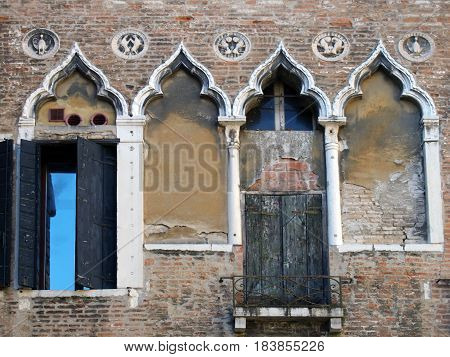 venice old building with ornate shuttered windows