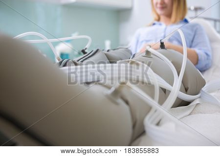 Woman Receiving Slimming Lymphatic Drainage Treatment At Beautician's