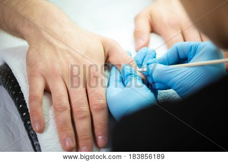 Close-up of man's hands at beautician's during manicure