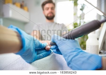 Close-up of man's hands at beautician's during manicure