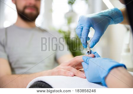 Close-up of man's hands at beautician's during manicure