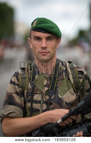 France Paris - 14 july 2011.Legionnaire photographer of the French foreign legion who performs the shooting of the parade on the Champs Elysees in Paris.