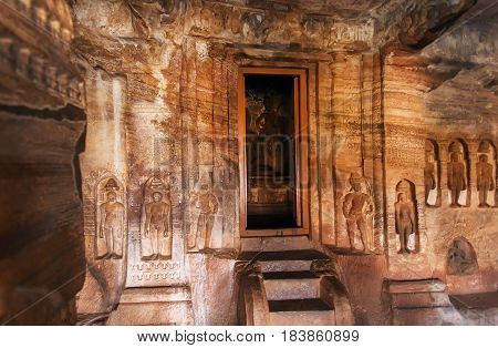 Door to sanctuary of the 7th century cave temple in Karnataka, India. Structure dedicated to the Jain Lord Mahavira