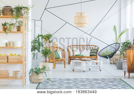 White botanic living room with rattan furniture set