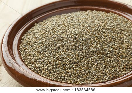 Dish with dried pearl millet close up
