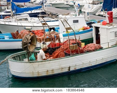 Fisherman System Networks On The Small Boat Moored In The Harbor