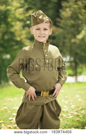 Russian boy in military uniform of the Soviet Army of the Second World War