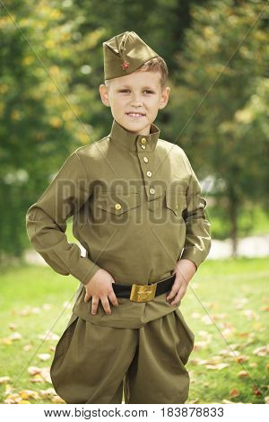 Russian boy in military uniform of the Soviet Army of the Second World War