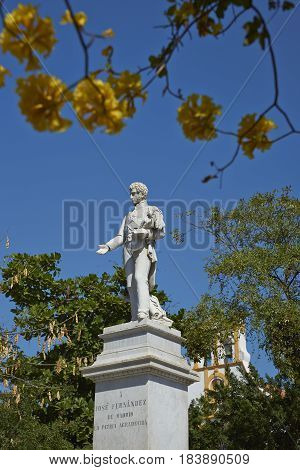 White stone statue of Jose Fernandez in a city square in the historic quarter of Cartagena de Indias in Colombia