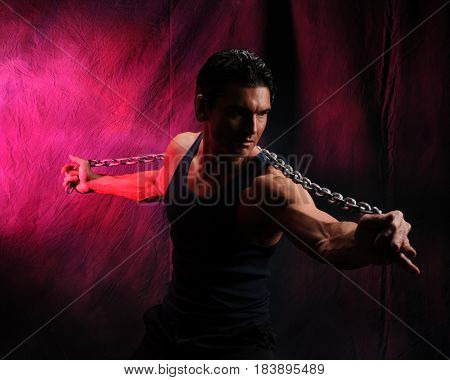 The cute guy is stretching out his arms.