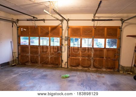 Old damaged garage doors at a house renovation.