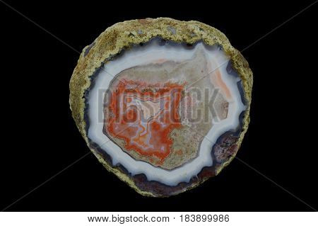 A cross section of the eyelet agate stone. Multicolored silica rings colored with metal oxides are visible. Origin: Asni Atlas Mountains Morocco.
