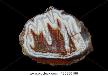 A cross section of the stalactite agate stone with quartz geode. Multicolored silica rings colored with metal oxides are visible. Origin: Asni Atlas Mountains Morocco.
