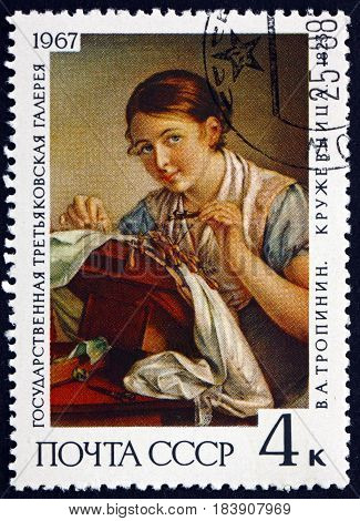 RUSSIA - CIRCA 1967: a stamp printed in Russia shows The Lacemaker Painting by V. A. Tropinin 1823 Russian Romantic Painter circa 1967
