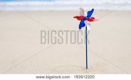 Independence Day USA background with decoration on the sandy beach near the ocean American patriotic concept