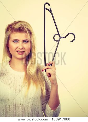 Blonde Woman Holding Clothes Hanger