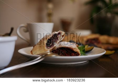 Delicious crispy pie with berry filling and a cup of coffee for dessert