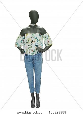 Full-length female mannequin dressed in top and blue jeans isolated on white background. No brand names or copyright objects.